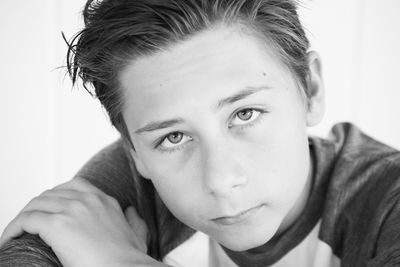 Close-up portrait of young man at home