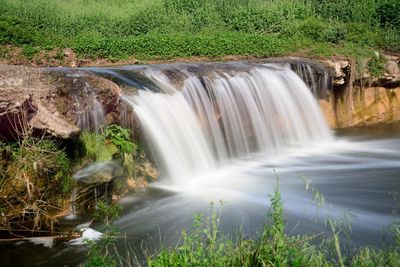 Scenic view of waterfall in forest