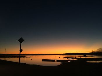 Scenic view of sea against clear sky during sunset