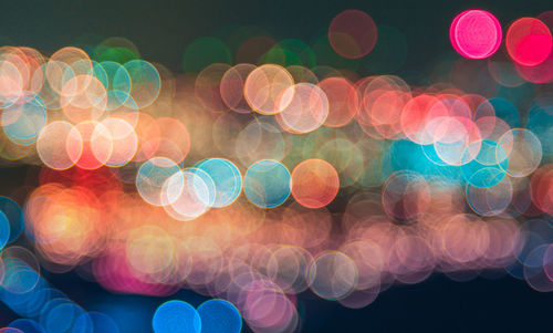 Defocused image of illuminated lights at night