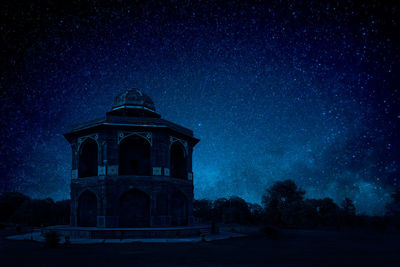 Low angle view of building against sky at night