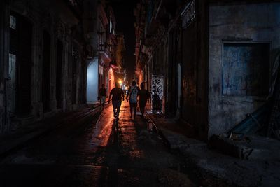 Rear view of people standing in building