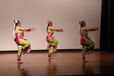 Group of people dancing on wooden floor