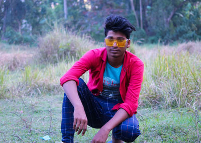 Portrait of young man on land