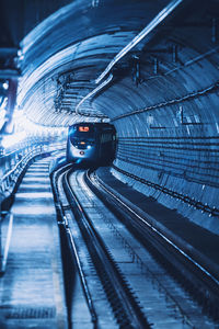 View of train on railroad track in tunnel