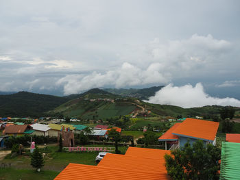 Houses and buildings against sky