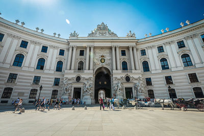 People in front of government building