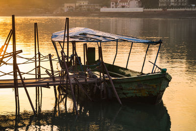 Wooden posts in lake