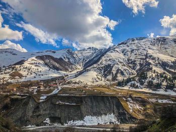 Scenic view of snowcapped mountains against sky