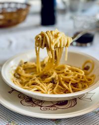 Close-up of noodles in bowl on table