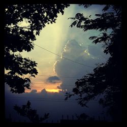 Low angle view of cloudy sky at sunset