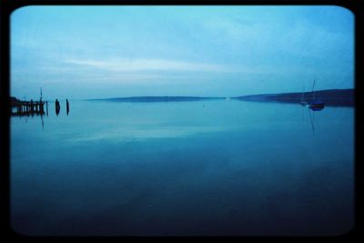 Scenic view of calm lake against clear sky