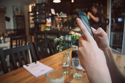 Close-up of hands using smart phone