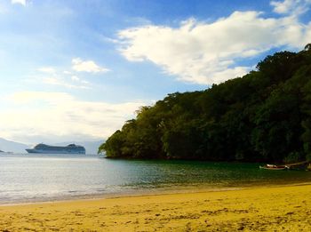 Scenic view of sea against cloudy sky