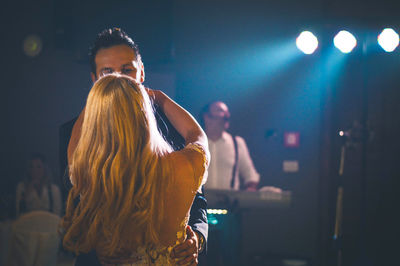 People enjoying music concert at night