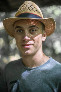 Portrait of young man wearing hat
