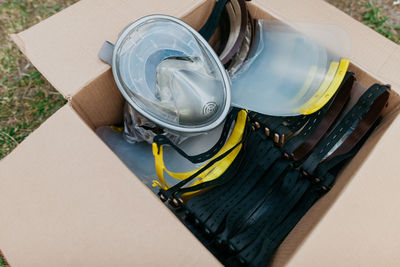 High angle view of paper in box on table