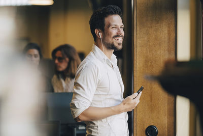 Man and woman standing on smart phone