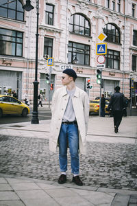 Woman standing on city street