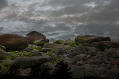 Scenic view of mountains against cloudy sky