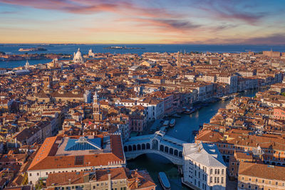 High angle view of city buildings during sunset