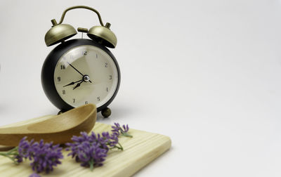 Close-up of clock against white background