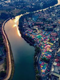 High angle view of river amidst buildings in city