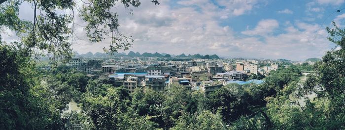 View of city against cloudy sky