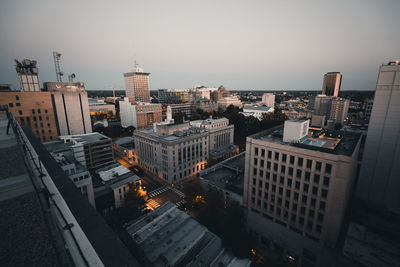 High angle view of buildings in city against clear sky