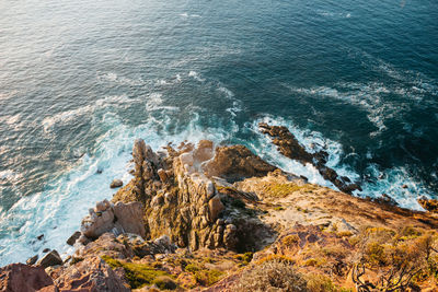 High angle view of rocks in sea