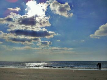 Scenic view of sea against cloudy sky