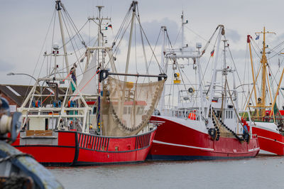 Boats moored at harbor