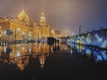 Illuminated buildings in city at night