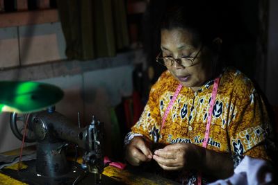 Woman focus on sewing 