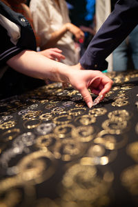 Cropped hand choosing earrings