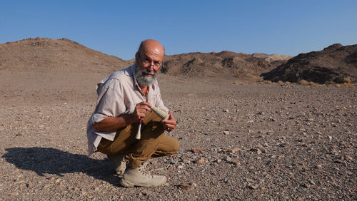 Archaeologist at work in the desert 