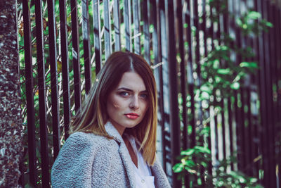 Portrait of a beautiful young woman in forest