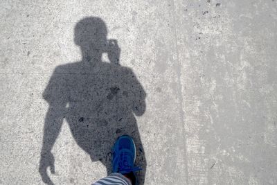 Shadow of man on sand