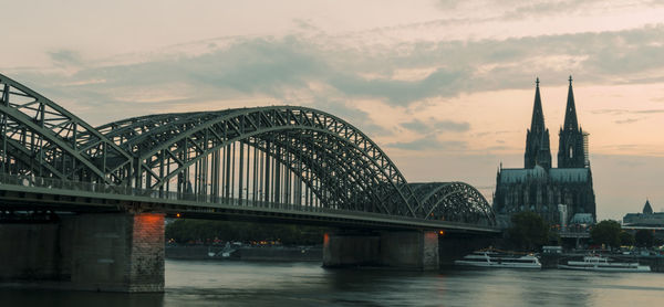 Arch bridge over river in city