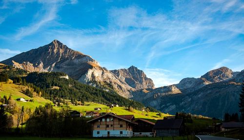 Panoramic view of houses and mountains against sky