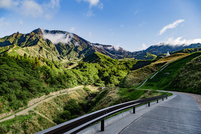 View on a road among mountains near aso volcano in kyushu, japan