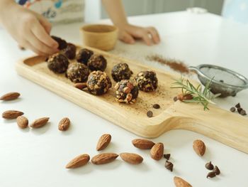 Close-up of person preparing food on cutting board