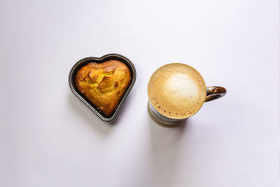 High angle view of coffee cup against white background