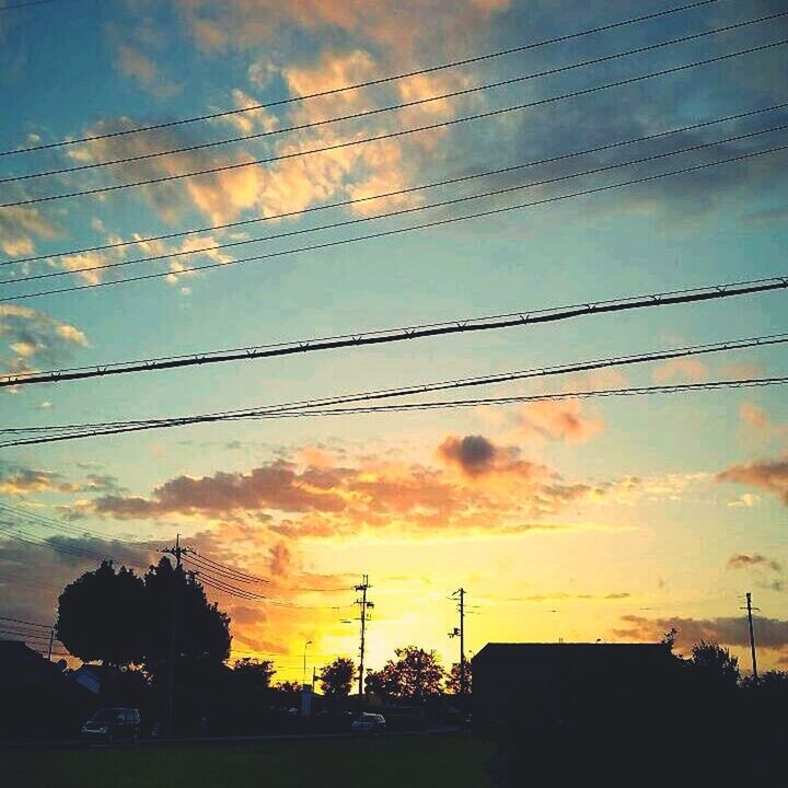 sunset, silhouette, sky, power line, cloud - sky, electricity pylon, orange color, cable, cloud, power supply, electricity, connection, beauty in nature, low angle view, scenics, dusk, cloudy, nature, dramatic sky, tranquility