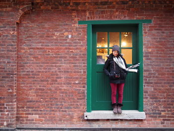 Woman standing at doorway