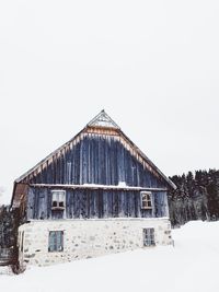 House against clear sky during winter