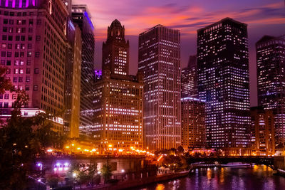 Illuminated buildings in city at night