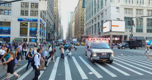 Vehicles on road along buildings