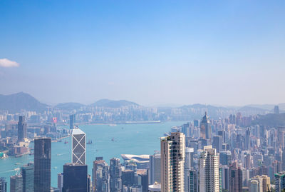 View of city by sea against sky