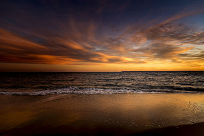 Scenic view of sea against sky at sunset